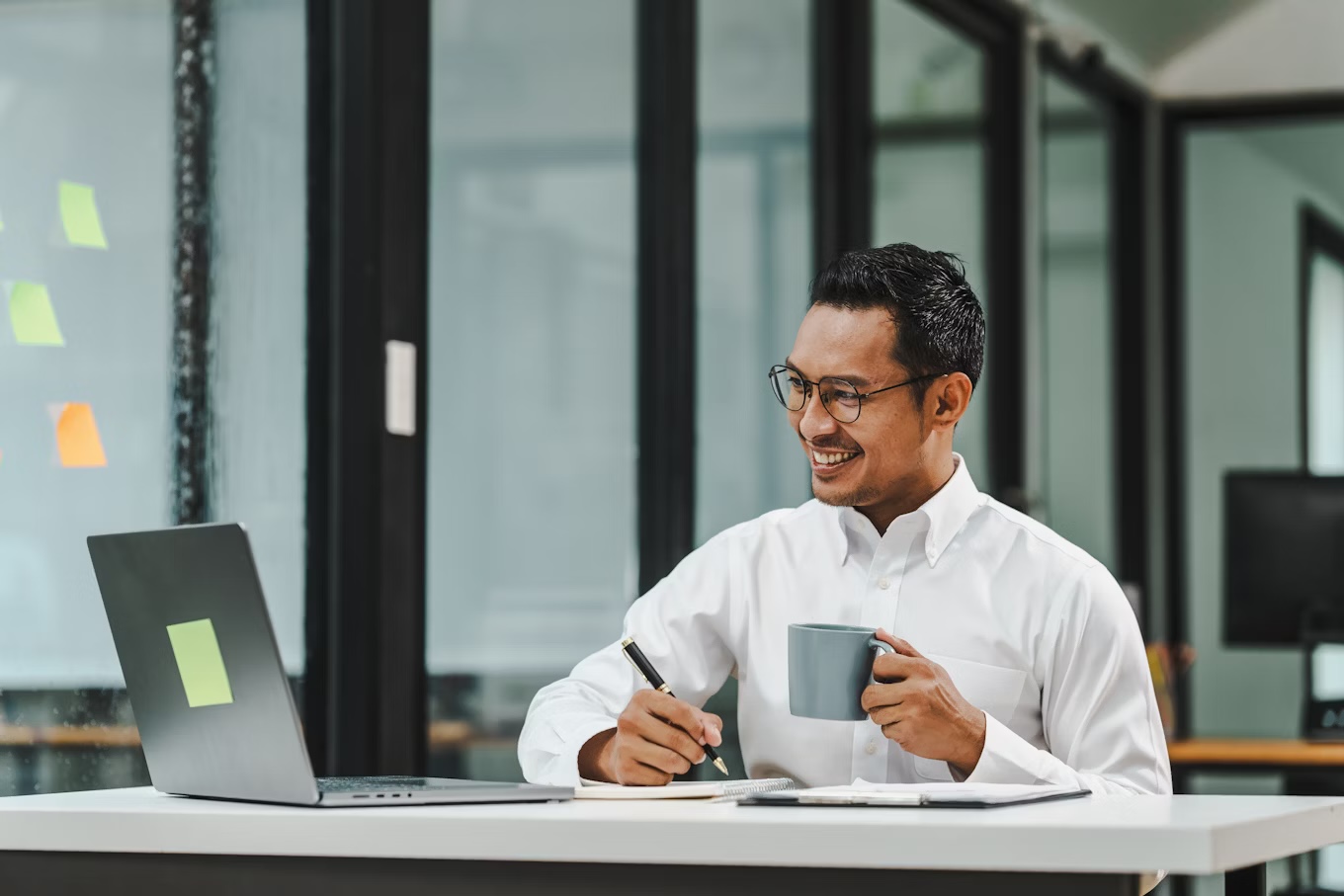 Professional researching on computer and iPad